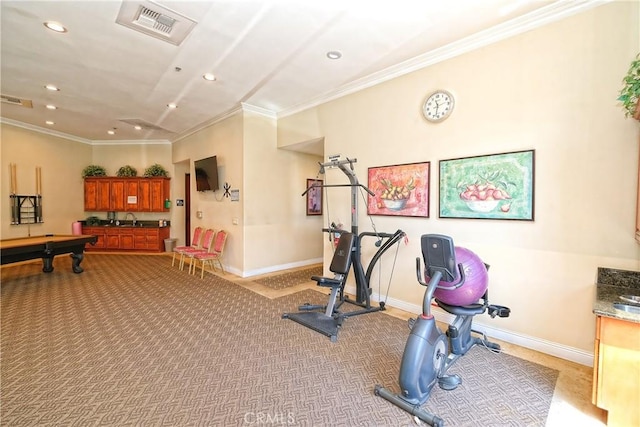 exercise room featuring sink, light colored carpet, billiards, and crown molding