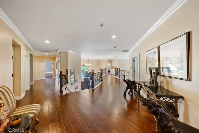 interior space featuring an inviting chandelier, dark hardwood / wood-style floors, and ornamental molding