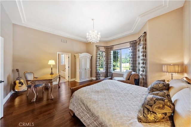 bedroom with dark hardwood / wood-style flooring, an inviting chandelier, and crown molding