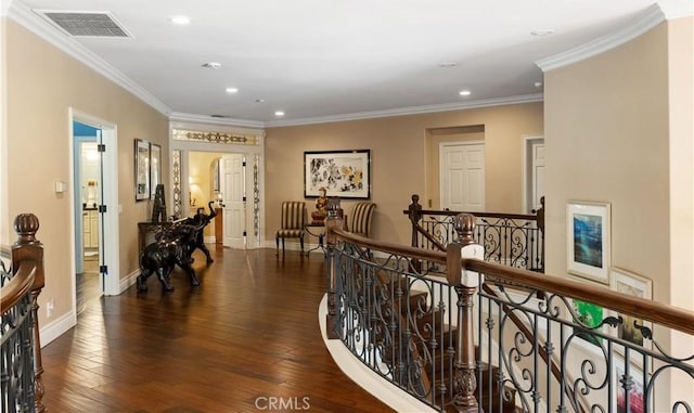 hallway with ornamental molding and dark wood-type flooring