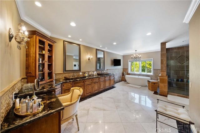 bathroom featuring tile patterned flooring, vanity, tile walls, and ornamental molding