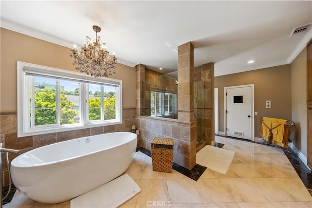 bathroom featuring separate shower and tub, tile patterned flooring, tile walls, and ornamental molding