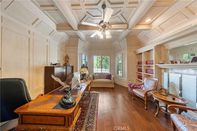 office featuring wood-type flooring, crown molding, ceiling fan, and coffered ceiling