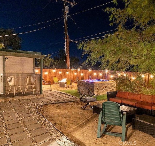 patio at night with outdoor lounge area