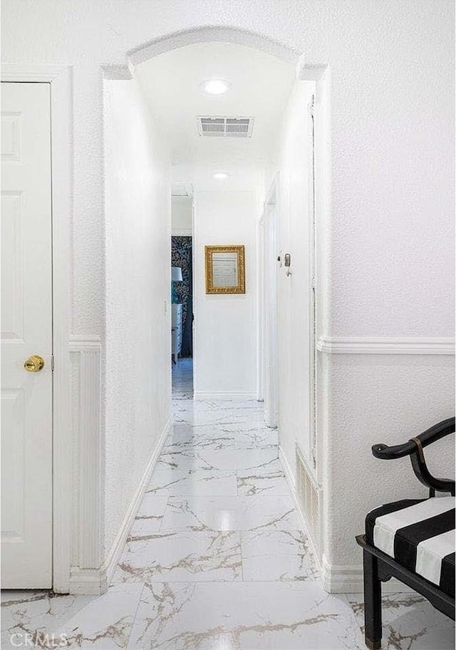 hallway featuring tile patterned floors