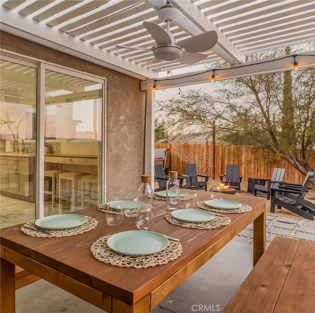 exterior space with ceiling fan and a pergola