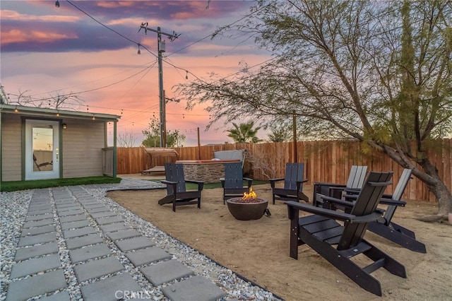 patio terrace at dusk with a fire pit