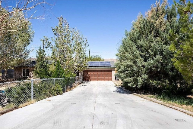 view of front of house featuring solar panels