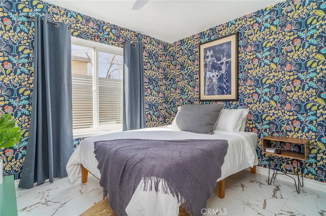 bedroom with tile patterned floors, multiple windows, and ceiling fan