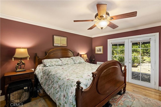 bedroom with access to outside, french doors, crown molding, and wood finished floors