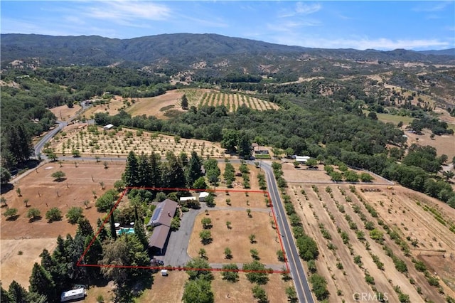 drone / aerial view featuring a rural view and a mountain view