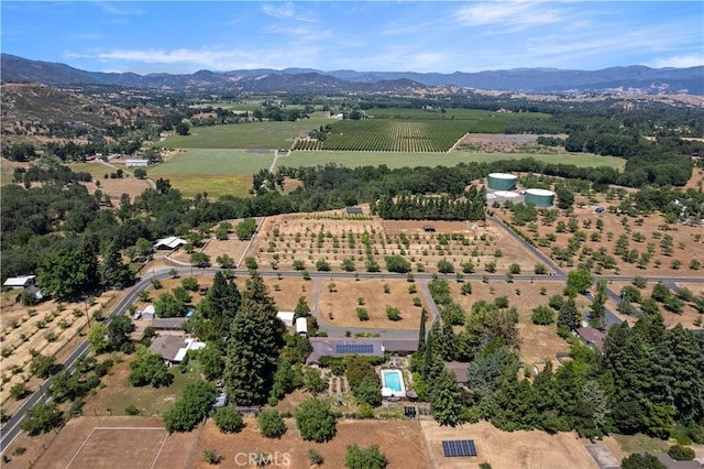 bird's eye view featuring a rural view and a mountain view