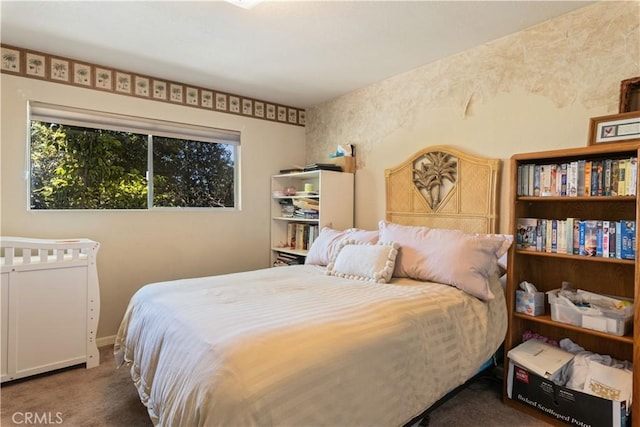 carpeted bedroom with baseboards