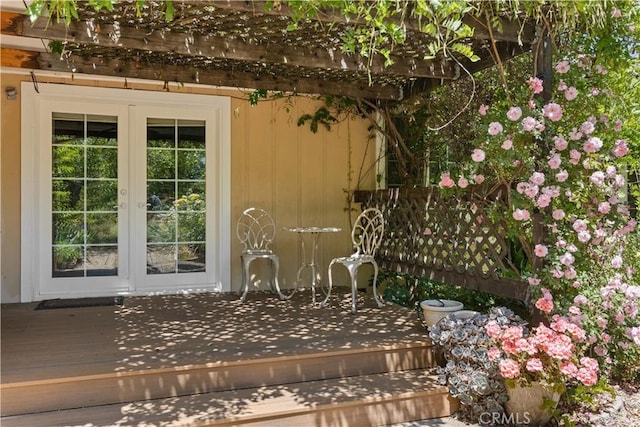 exterior space featuring french doors and a wooden deck