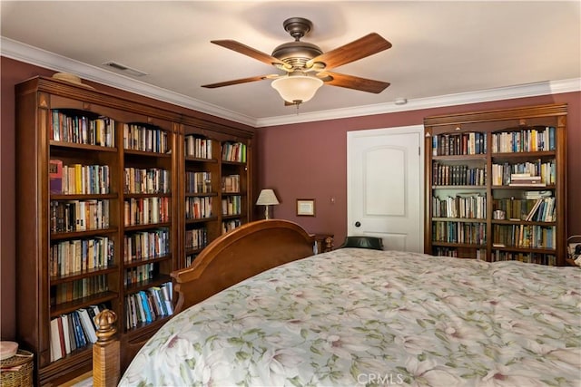 bedroom with visible vents and crown molding