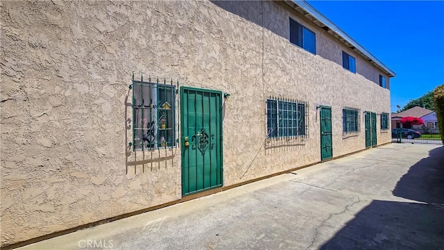 947 S Sunol Dr, Los Angeles, CA 90023 - view of side of home with stucco siding and a patio area