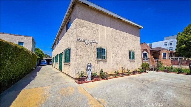 947 S Sunol Dr, Los Angeles, CA 90023 - view of side of home featuring stucco siding