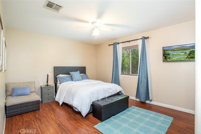 bedroom featuring ceiling fan and dark hardwood / wood-style flooring