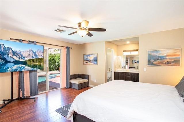 bedroom featuring access to exterior, ceiling fan, sink, dark hardwood / wood-style floors, and ensuite bathroom