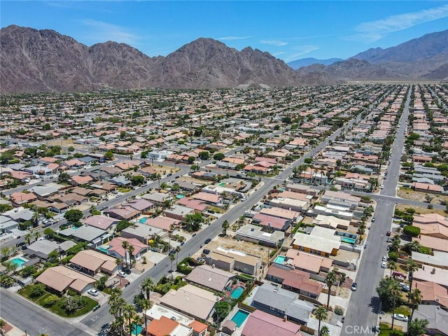 birds eye view of property with a mountain view