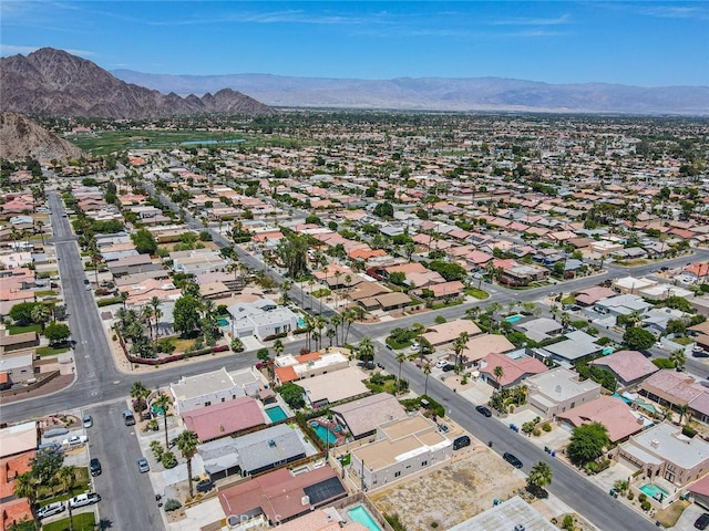 birds eye view of property featuring a mountain view