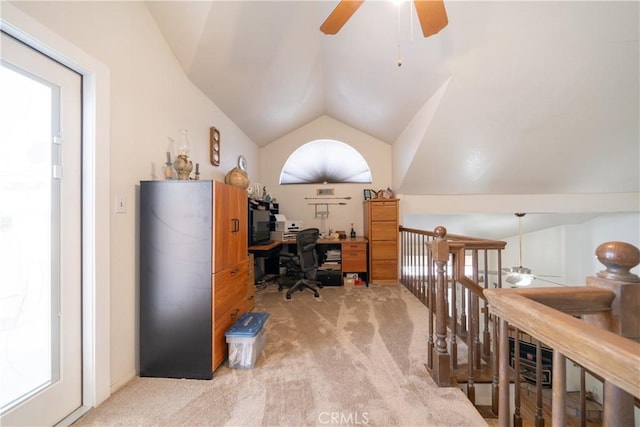 office space with carpet flooring, ceiling fan, and lofted ceiling