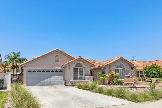 mediterranean / spanish-style house featuring a garage