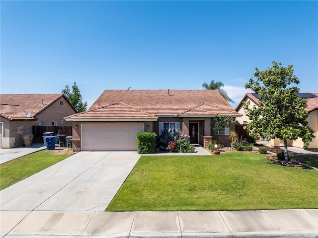 view of front of home with a garage and a front lawn