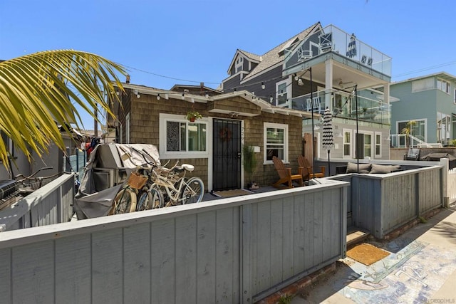 view of front of house with a balcony