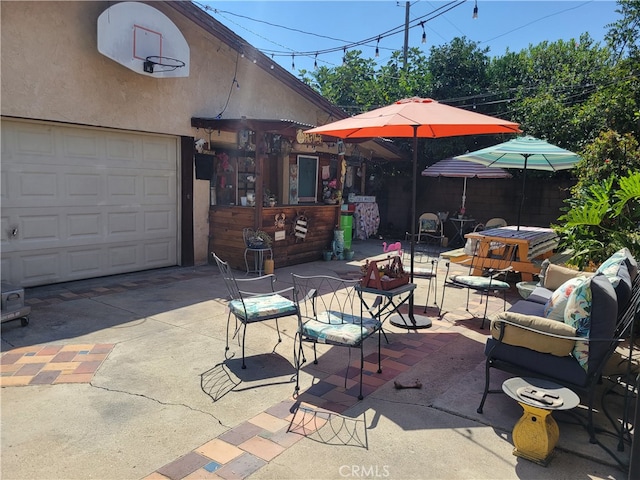 view of patio / terrace with a garage