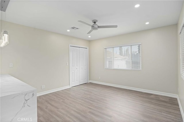 interior space with ceiling fan and light wood-type flooring