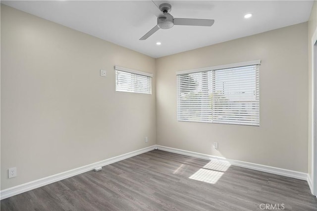 unfurnished room featuring ceiling fan and hardwood / wood-style flooring