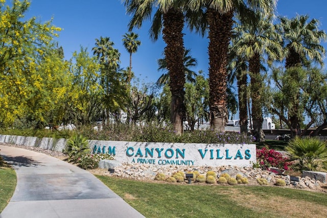 community / neighborhood sign featuring a lawn