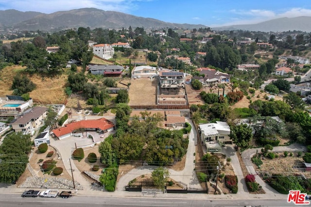 birds eye view of property featuring a mountain view