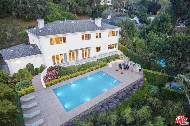 rear view of property featuring a patio area