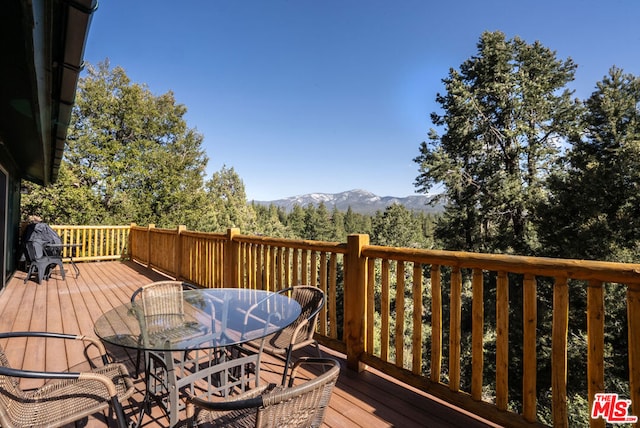 wooden terrace with a mountain view