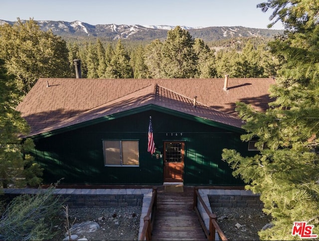 rear view of property with a mountain view