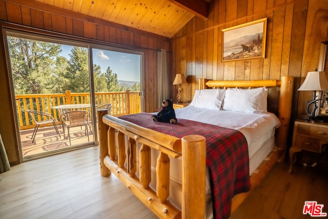 bedroom featuring access to exterior, wooden ceiling, lofted ceiling with beams, wooden walls, and hardwood / wood-style flooring