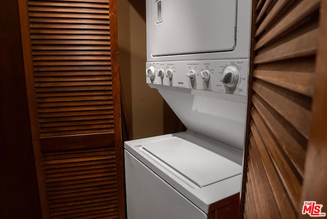 laundry room featuring stacked washing maching and dryer