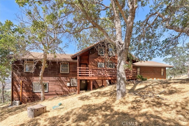 view of front of property with a wooden deck