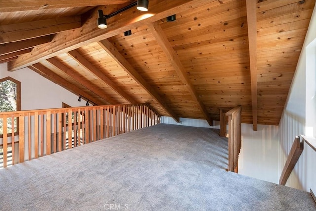 additional living space with vaulted ceiling with beams, carpet, and wooden ceiling