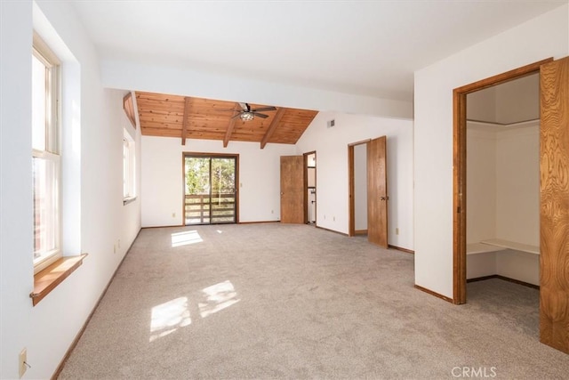 interior space featuring vaulted ceiling with beams, visible vents, wood ceiling, baseboards, and carpet