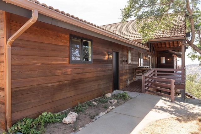 view of home's exterior featuring a tiled roof