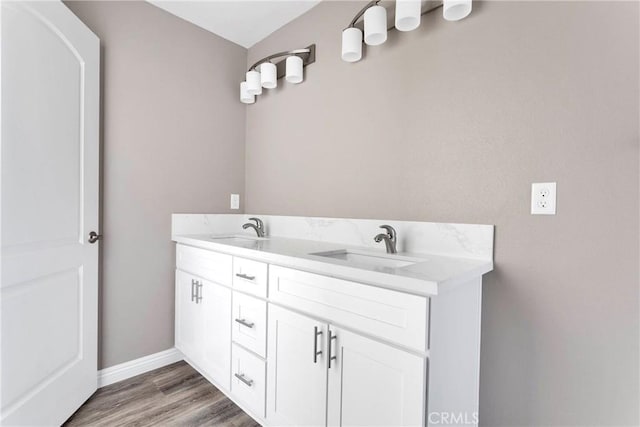 bathroom featuring vanity and hardwood / wood-style flooring