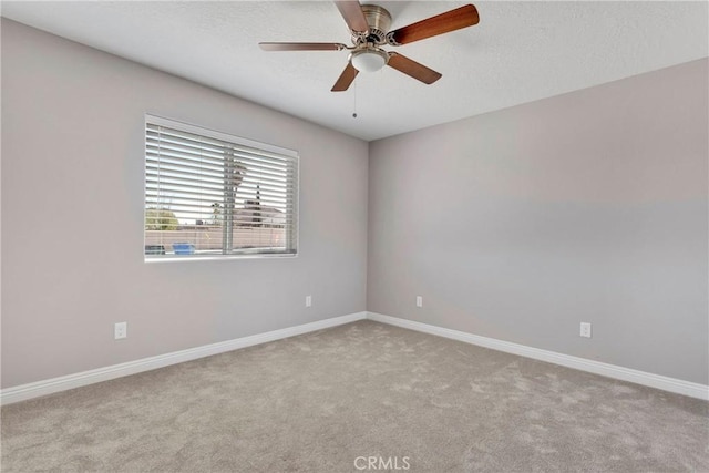 unfurnished room with light carpet and ceiling fan