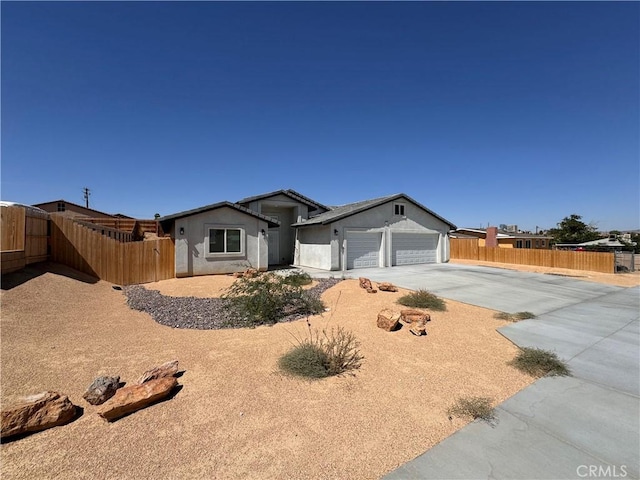 ranch-style home featuring a garage