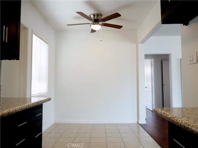 kitchen with ceiling fan and light tile patterned floors