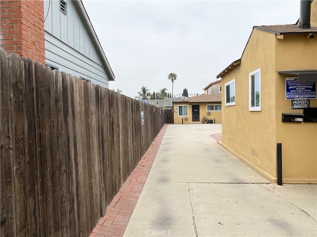 view of side of property featuring a patio