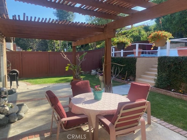 view of patio featuring a pergola