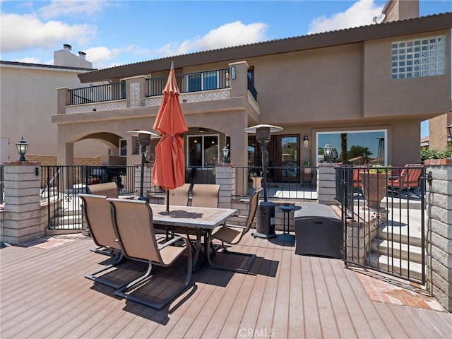 wooden terrace with outdoor dining space